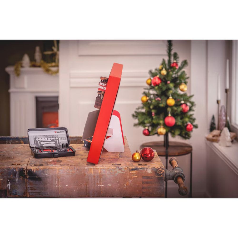Würth Advent Calendar 24 Pieces – Side view of toolbox and contents on workbench with Christmas tree in background